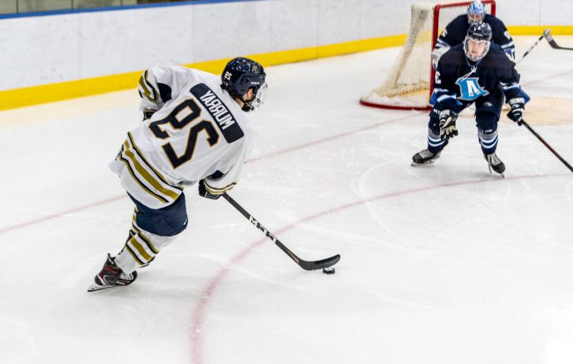 Trinity College mens Hockey player competing on ice