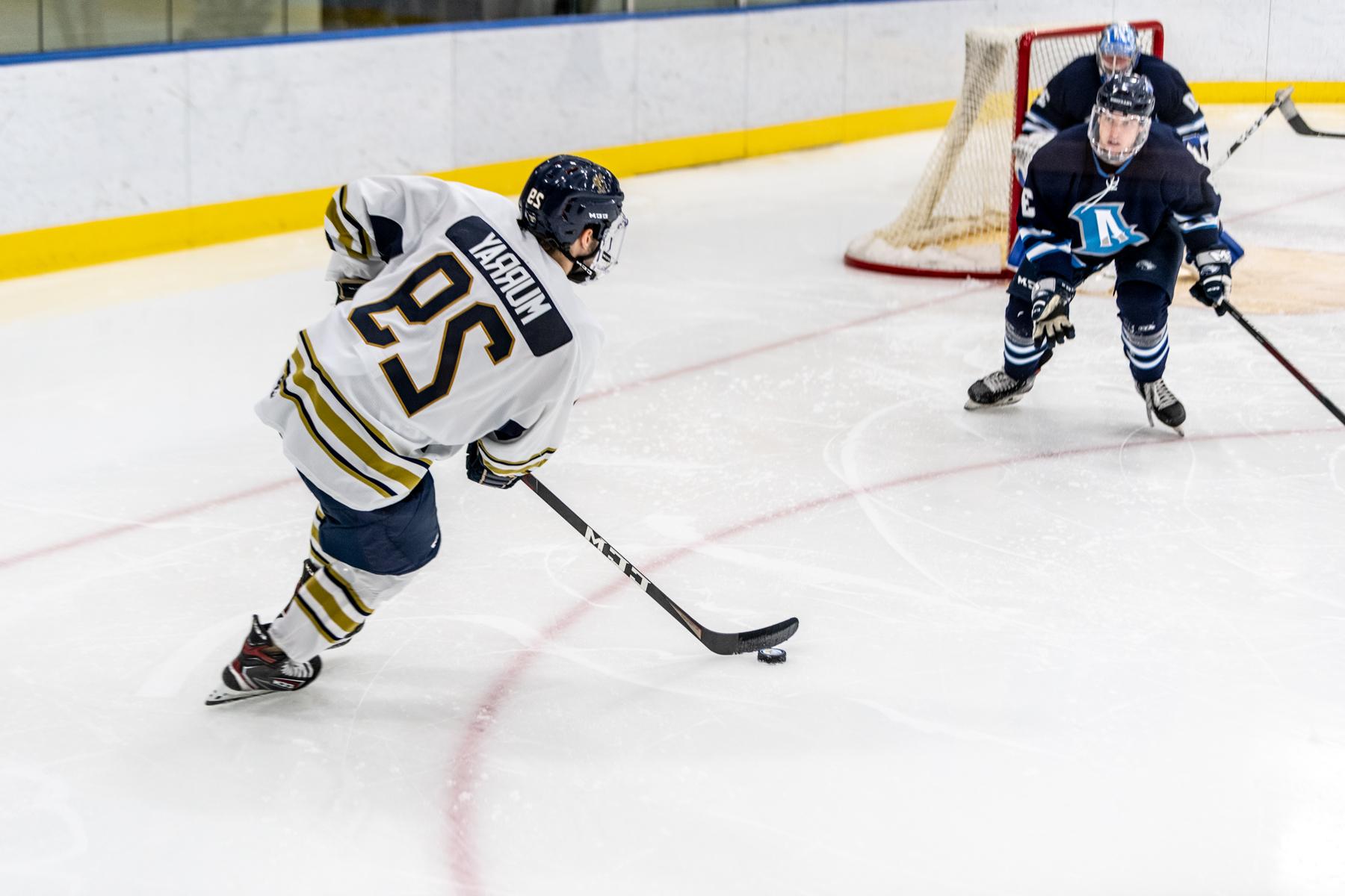 Trinity College mens Hockey player competing on ice